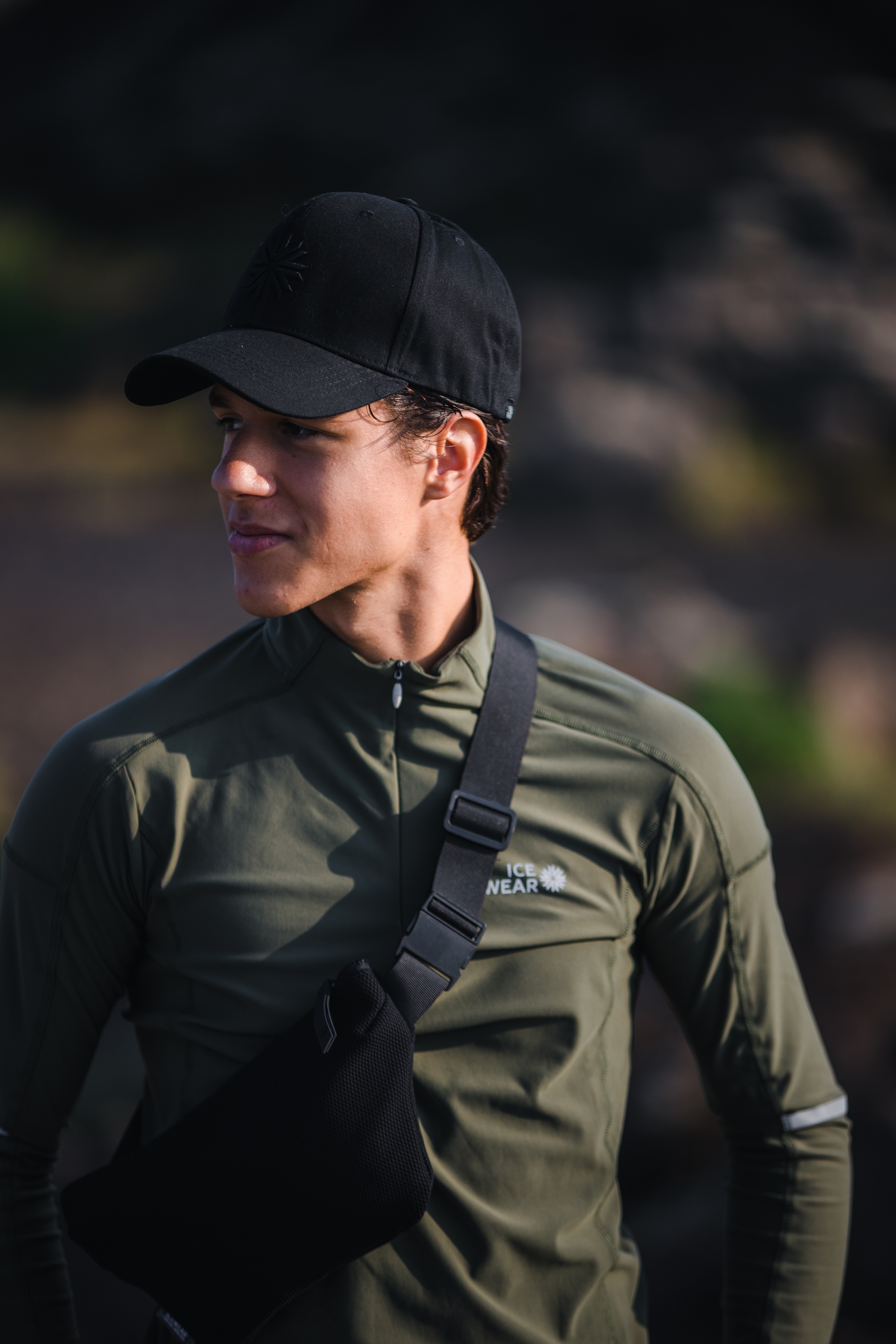man-green-sweater-bag-cap-3.jpeg