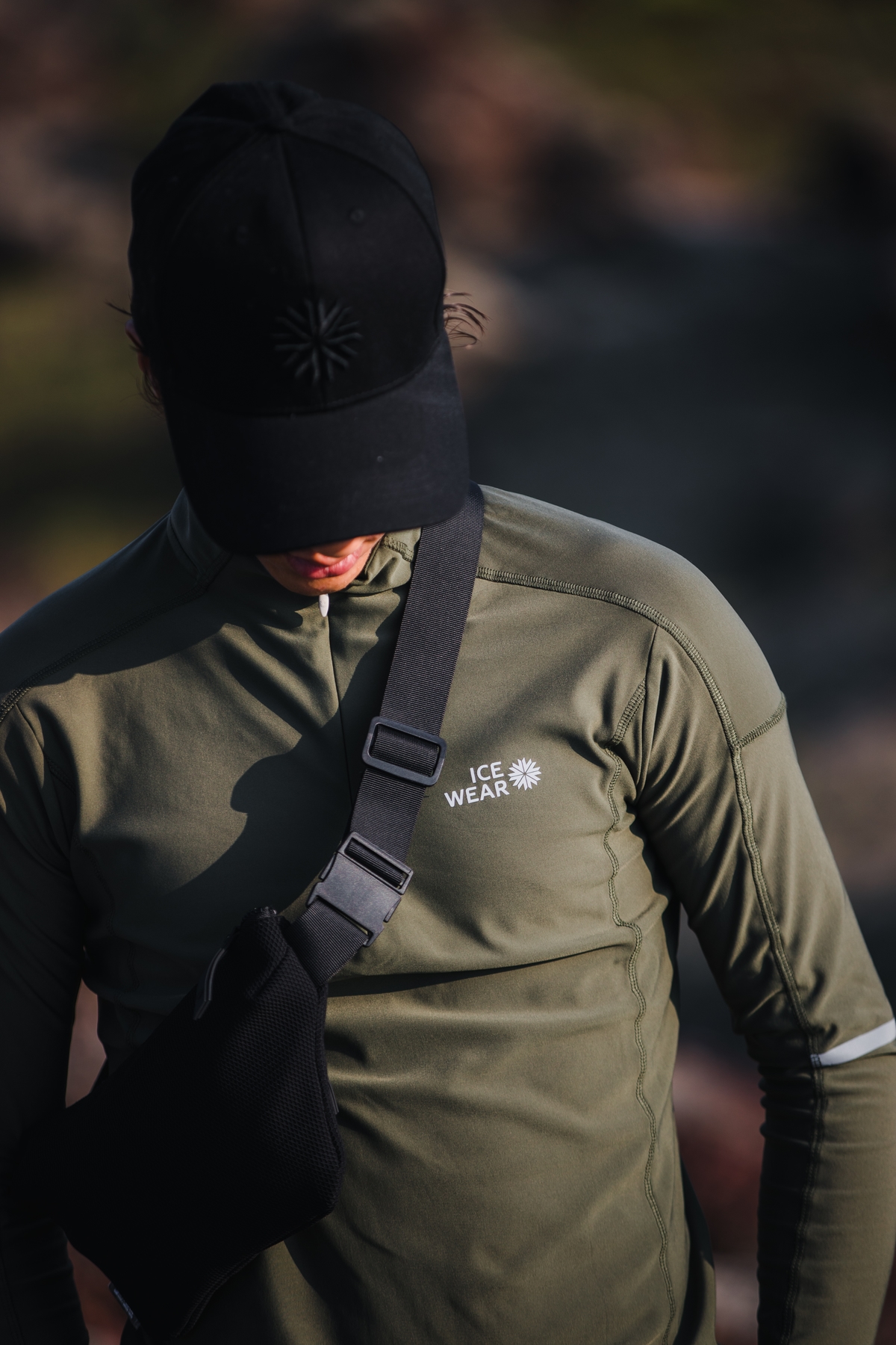 man-green-sweater-bag-cap.jpeg